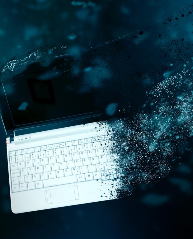 Computer Disintegrating To Show Data Destruction